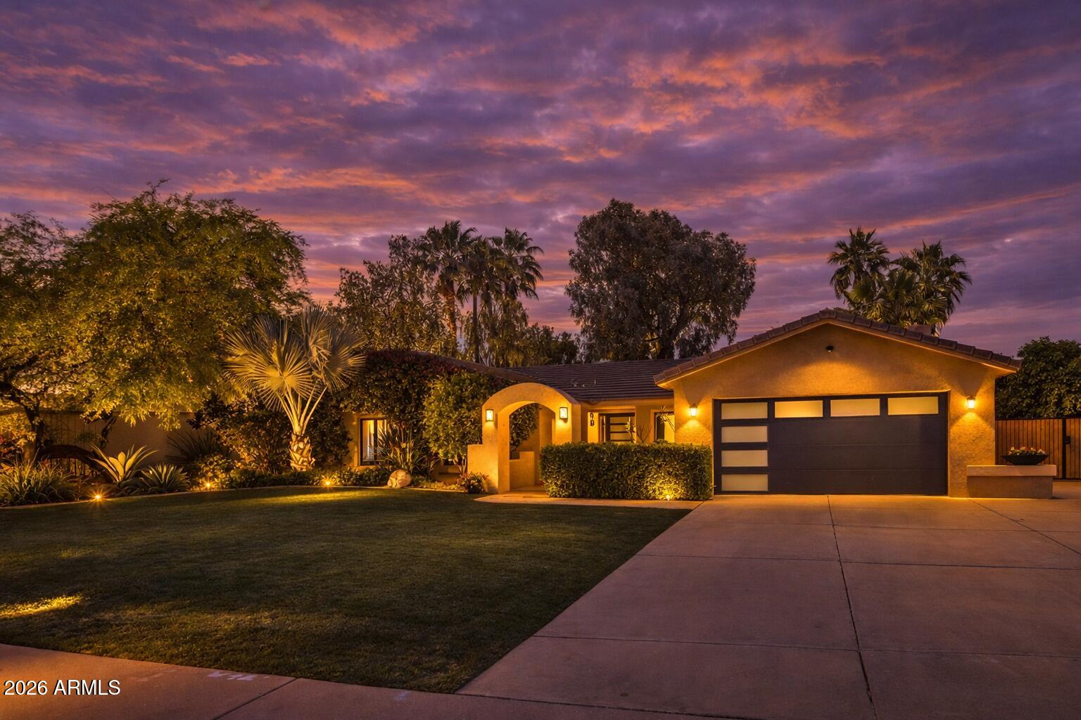 7414 East Corrine Road Scottsdale, AZ 85260 - Photo 66 of 67 a front view of a house with a yard