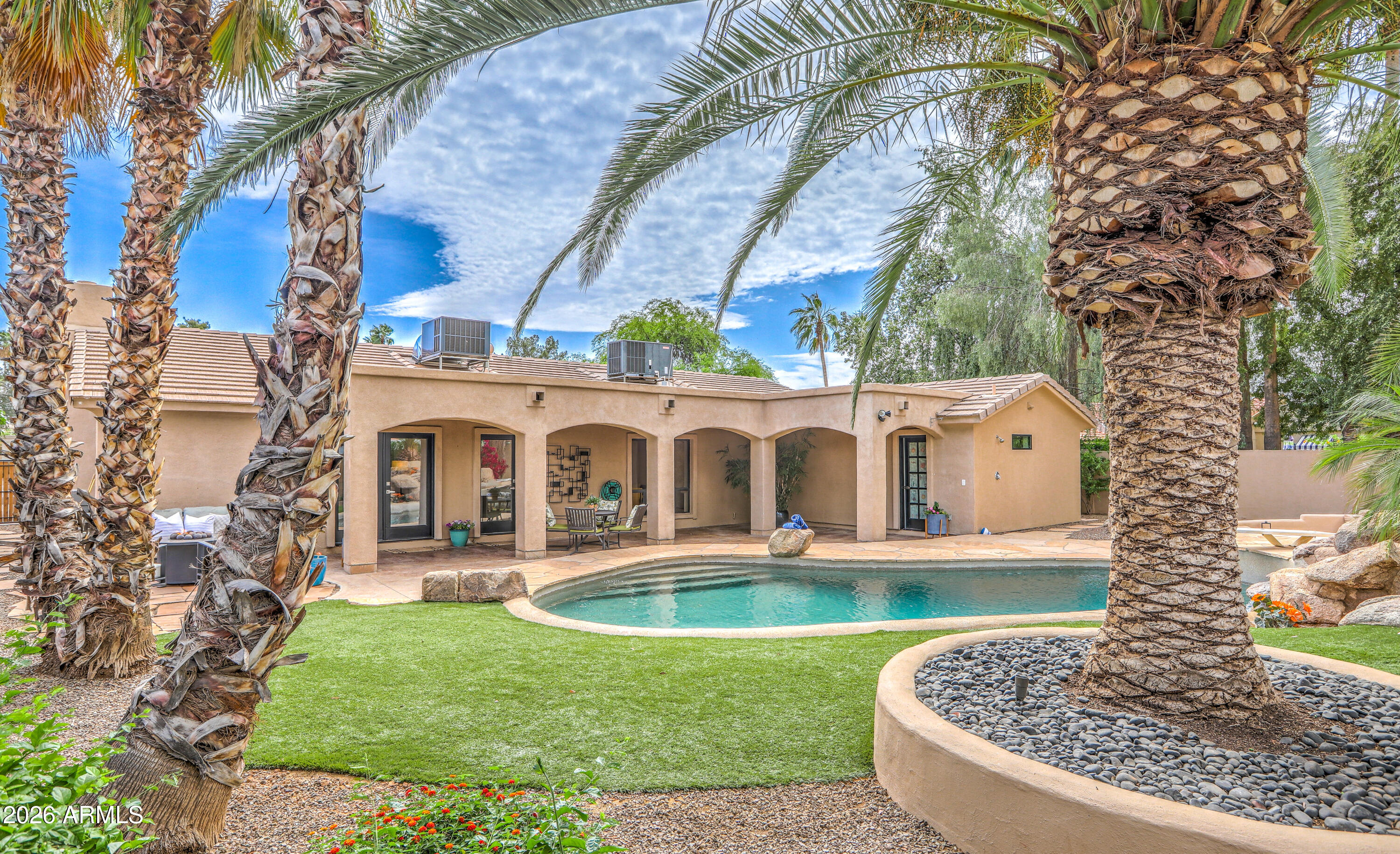 7414 East Corrine Road Scottsdale, AZ 85260 - Photo 7 of 67 a front view of a house with garden
