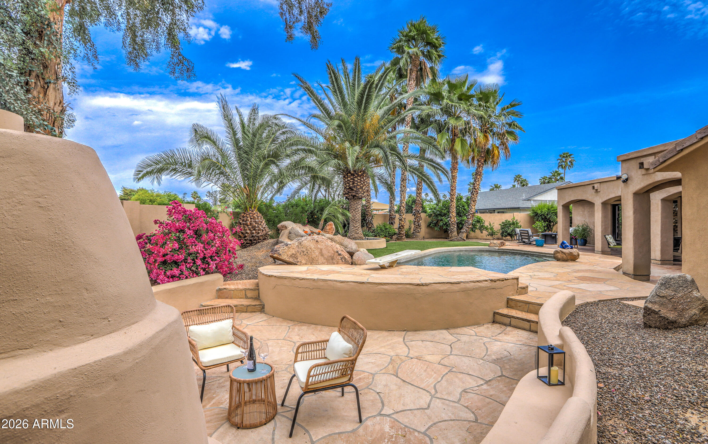 7414 East Corrine Road Scottsdale, AZ 85260 - Photo 9 of 67 a view of a swimming pool with a patio