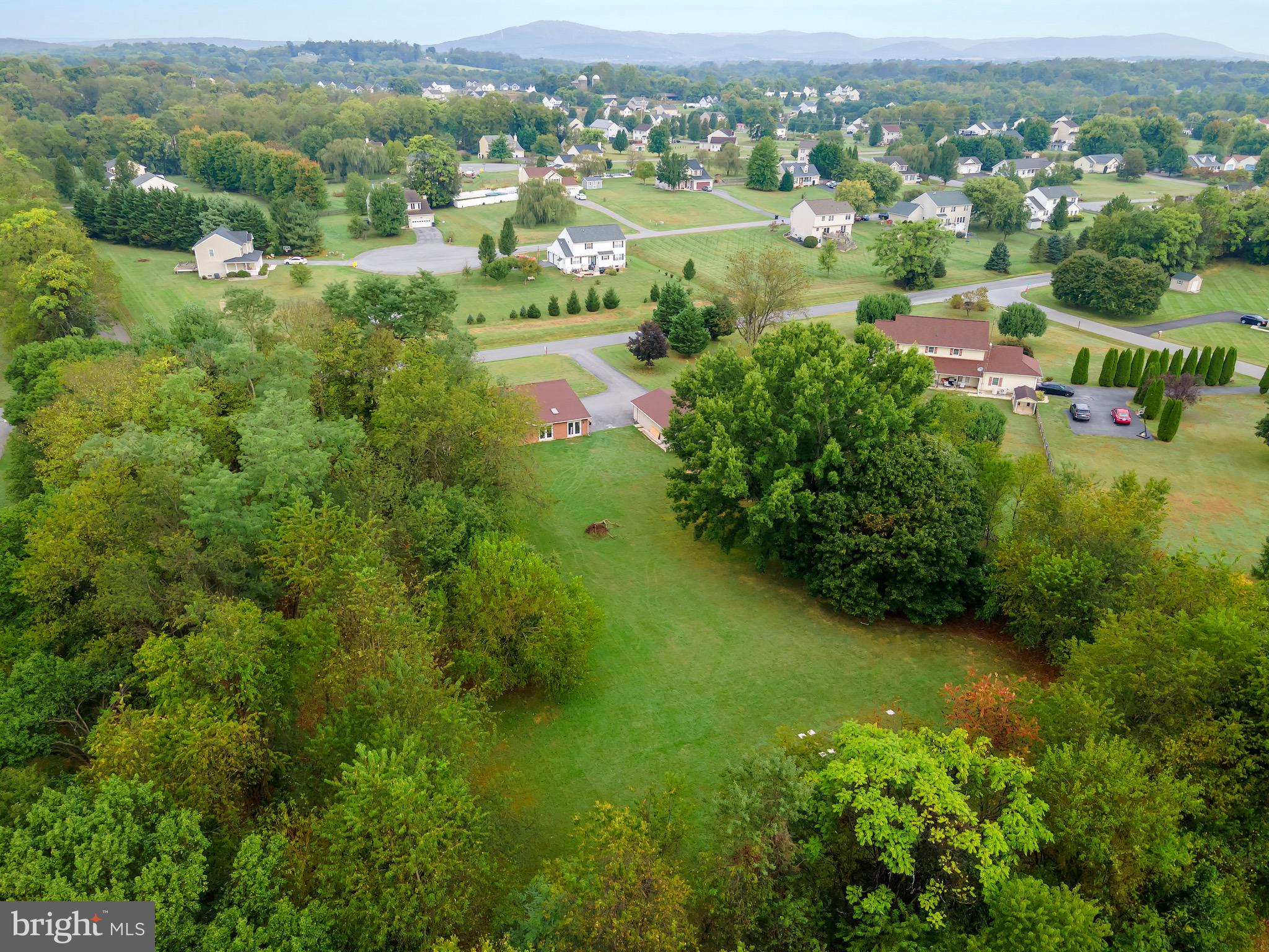 1414 Kitchens Orchard Falling Waters, WV 25419 - Photo 11 of 55 an aerial view of residential houses with outdoor space and trees