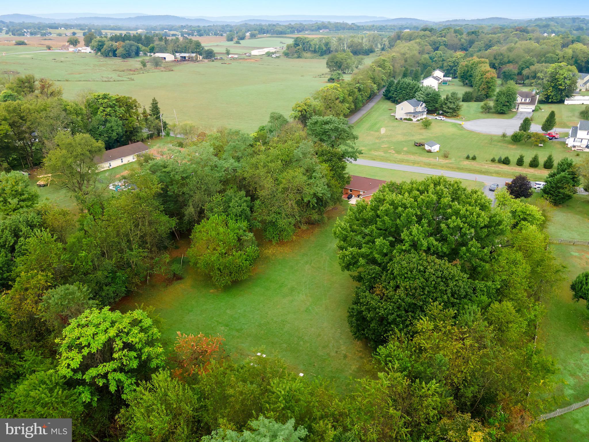 1414 Kitchens Orchard Falling Waters, WV 25419 - Photo 14 of 55 an aerial view of lake with residential houses with outdoor space and trees