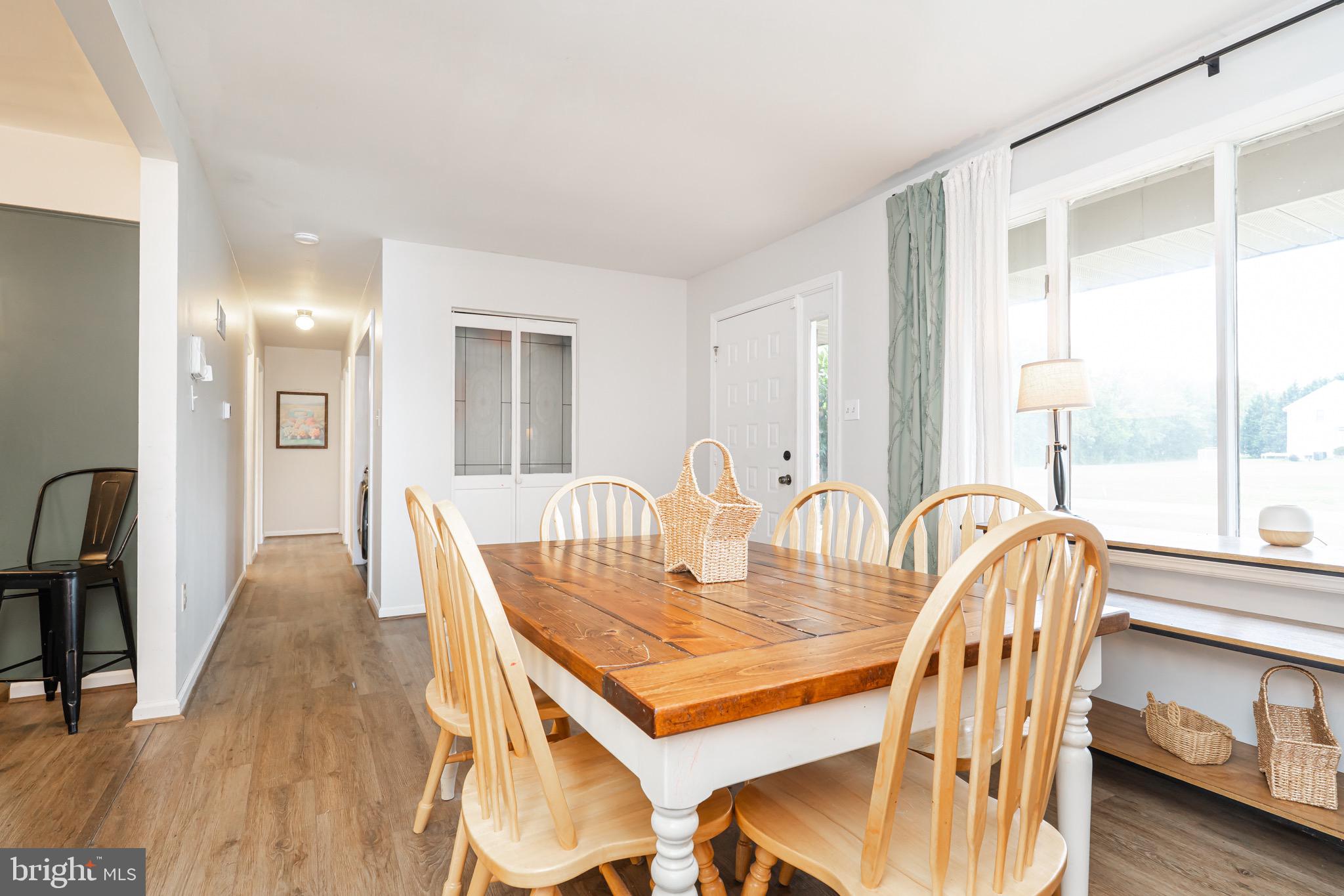 1414 Kitchens Orchard Falling Waters, WV 25419 - Photo 21 of 55 a view of a dining room with furniture and wooden floor