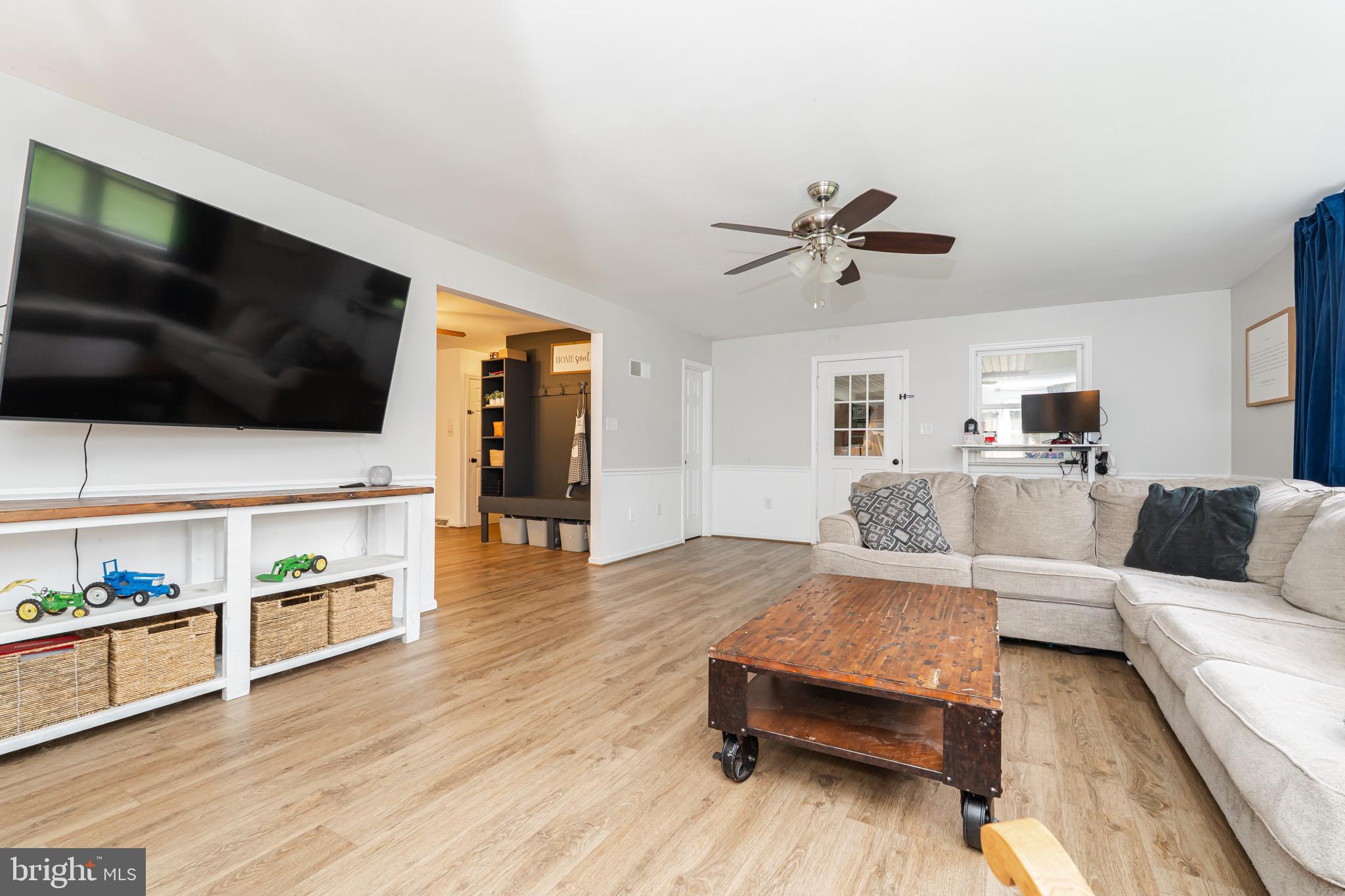 1414 Kitchens Orchard Falling Waters, WV 25419 - Photo 29 of 55 a living room with furniture and a flat screen tv