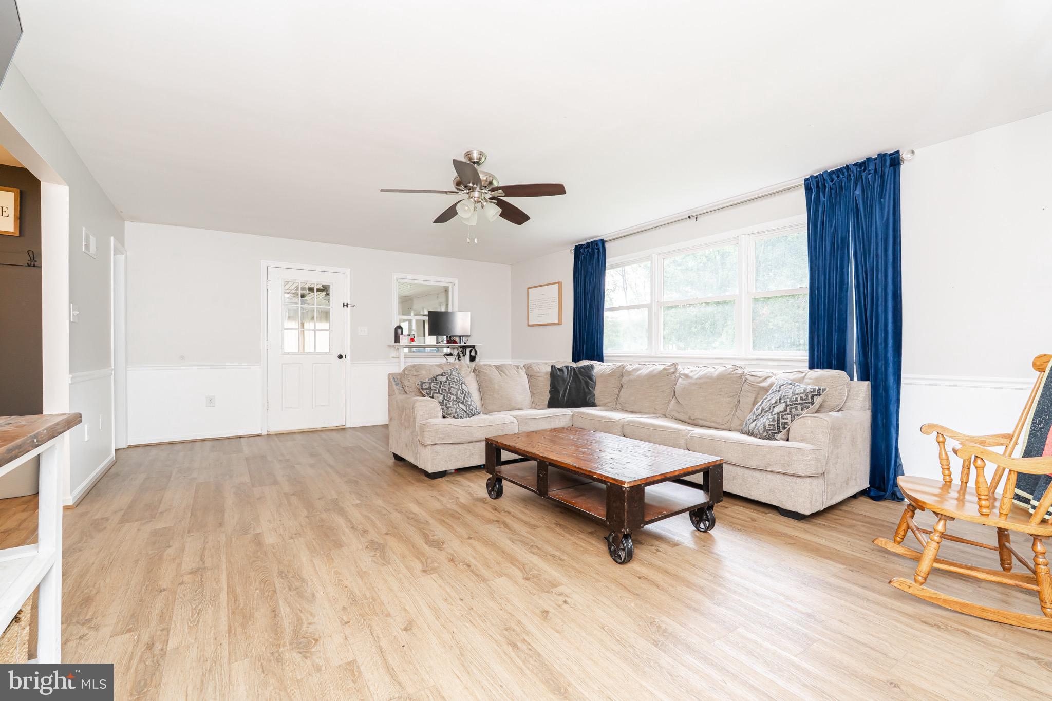 1414 Kitchens Orchard Falling Waters, WV 25419 - Photo 31 of 55 a living room with furniture and a large window
