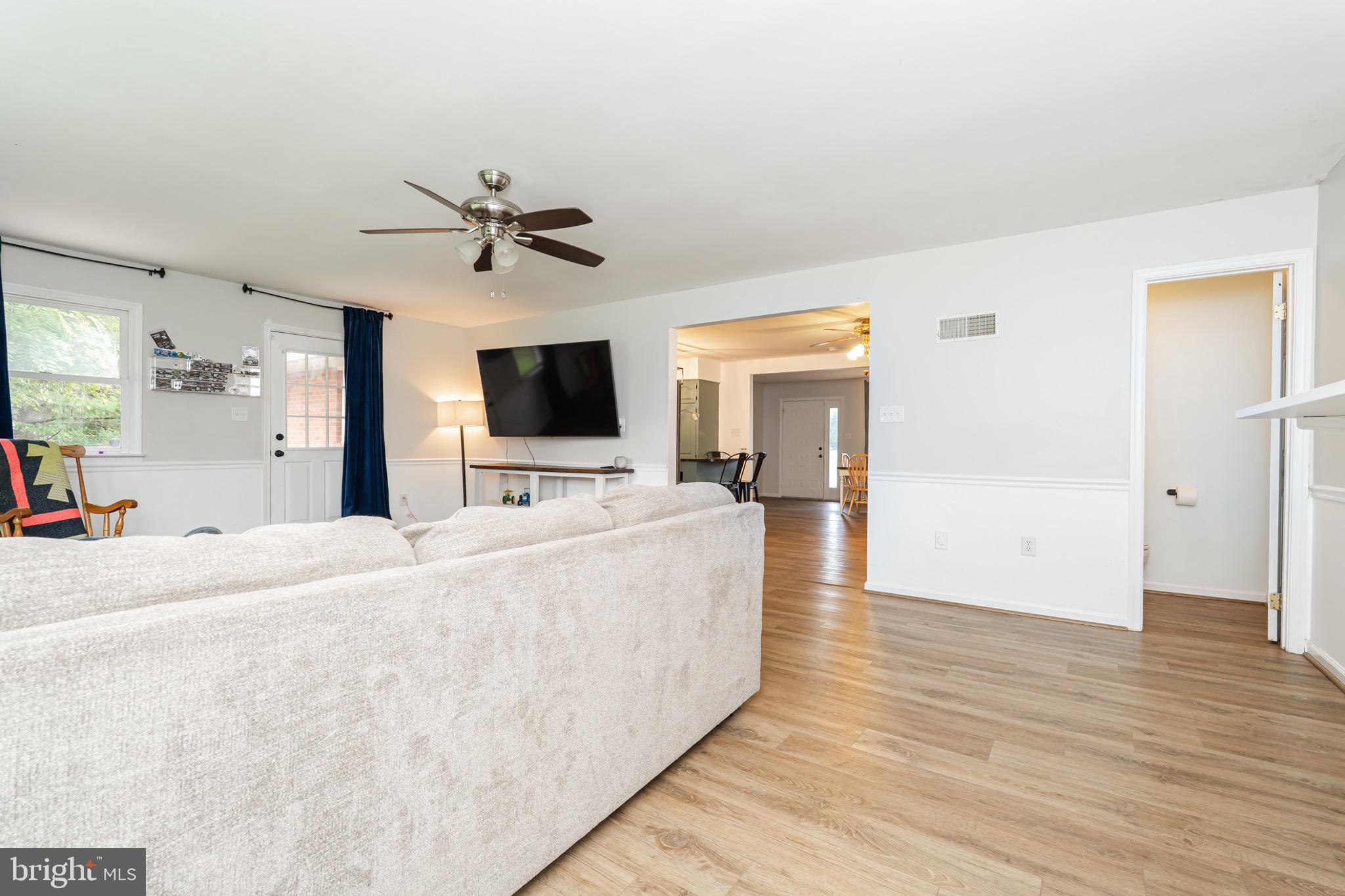 1414 Kitchens Orchard Falling Waters, WV 25419 - Photo 33 of 55 a living room with furniture and a flat screen tv