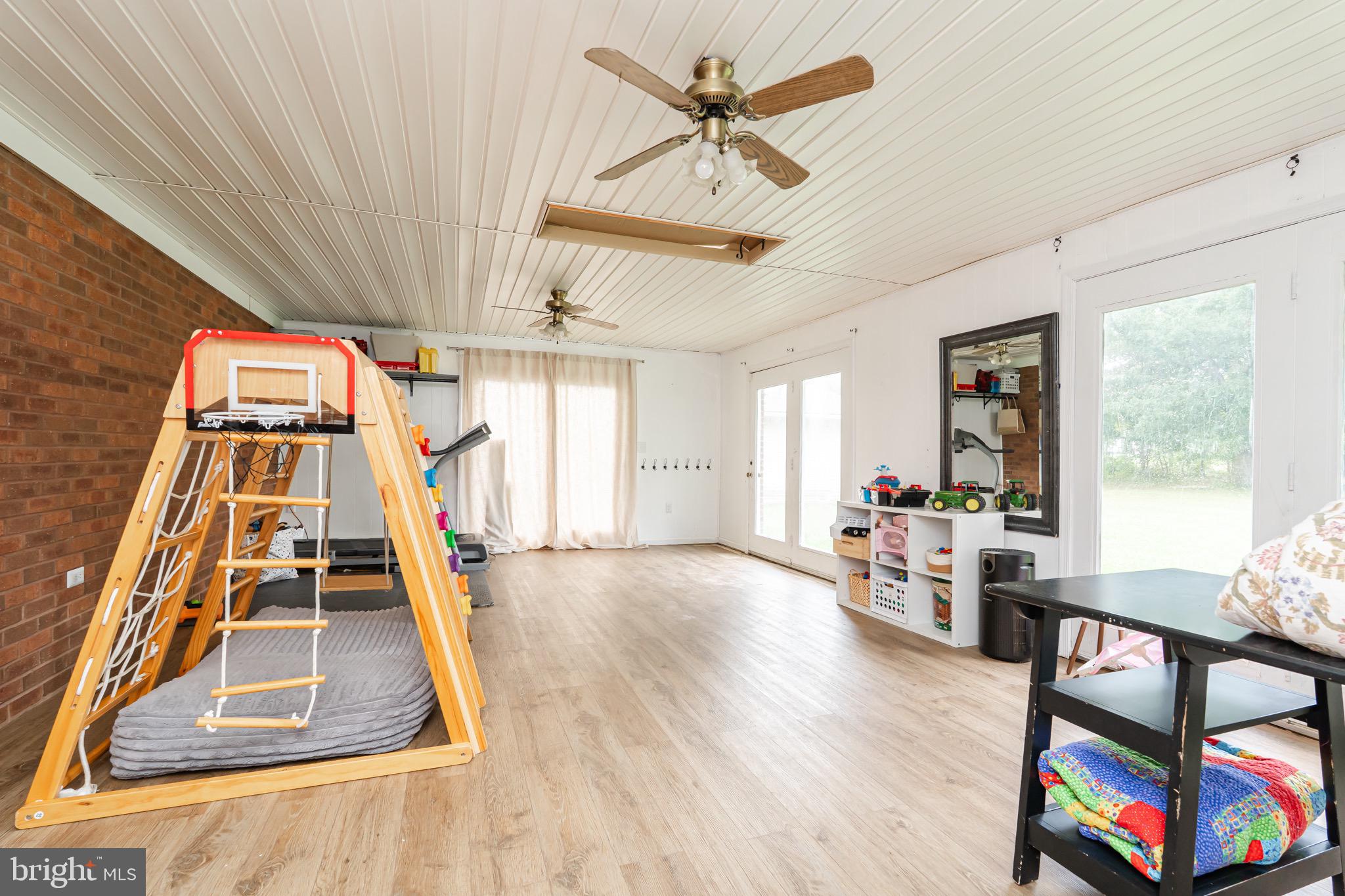 1414 Kitchens Orchard Falling Waters, WV 25419 - Photo 35 of 55 a view of a livingroom with furniture hardwood floor and a ceiling fan