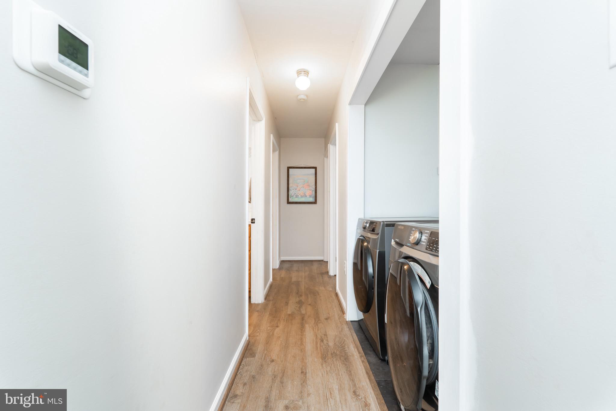 1414 Kitchens Orchard Falling Waters, WV 25419 - Photo 37 of 55 a view of a hallway with washer and dryer