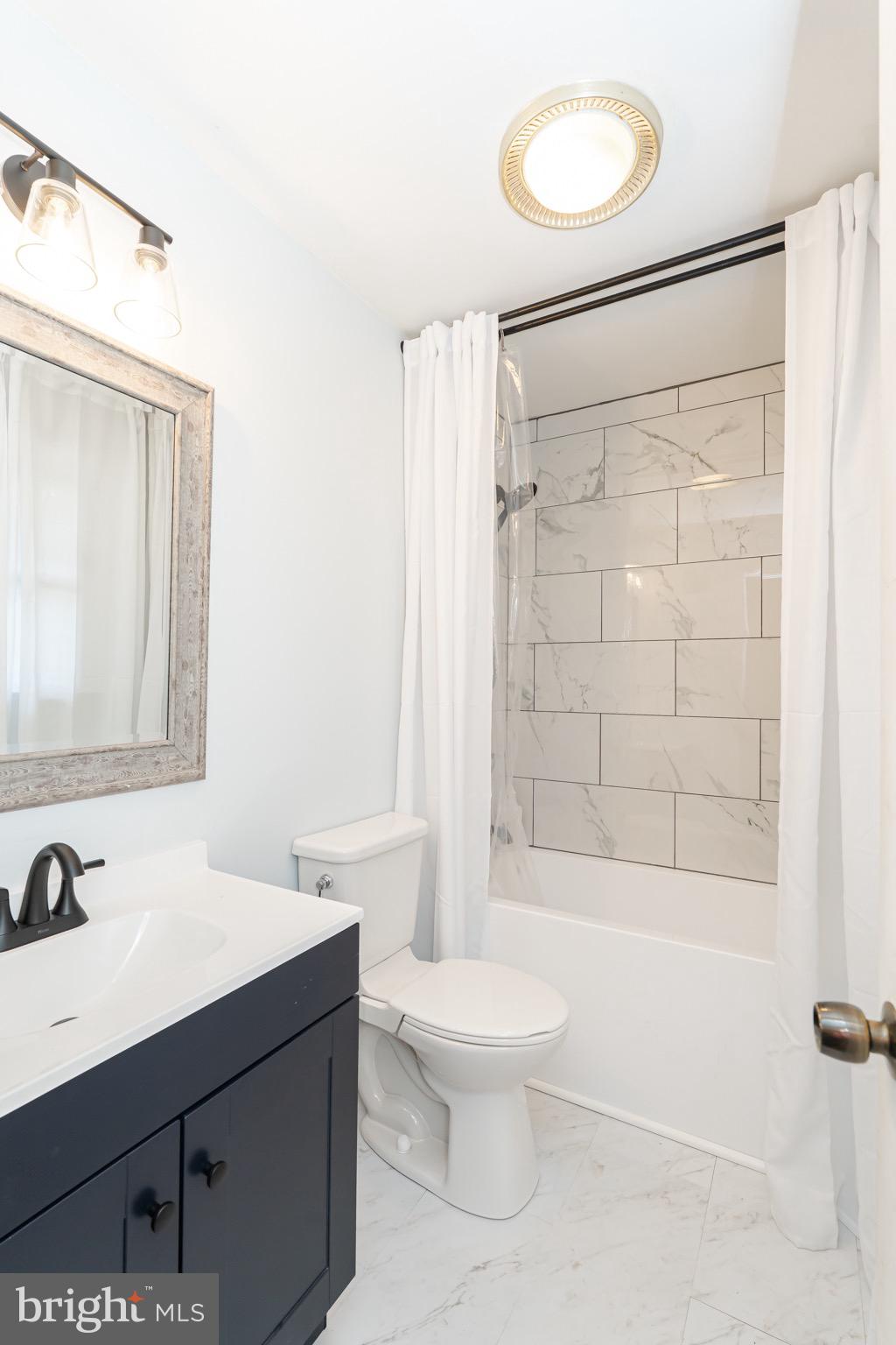 1414 Kitchens Orchard Falling Waters, WV 25419 - Photo 43 of 55 a bathroom with a sink toilet and shower