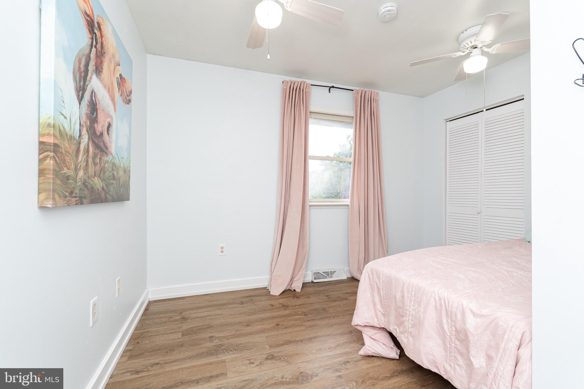 1414 Kitchens Orchard Falling Waters, WV 25419 - Photo 45 of 55 a bedroom with a bed and a painting on the wall