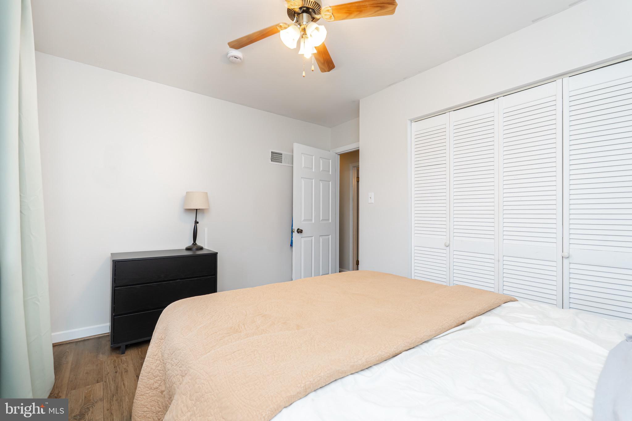 1414 Kitchens Orchard Falling Waters, WV 25419 - Photo 51 of 55 a bedroom with a bed and a chandelier