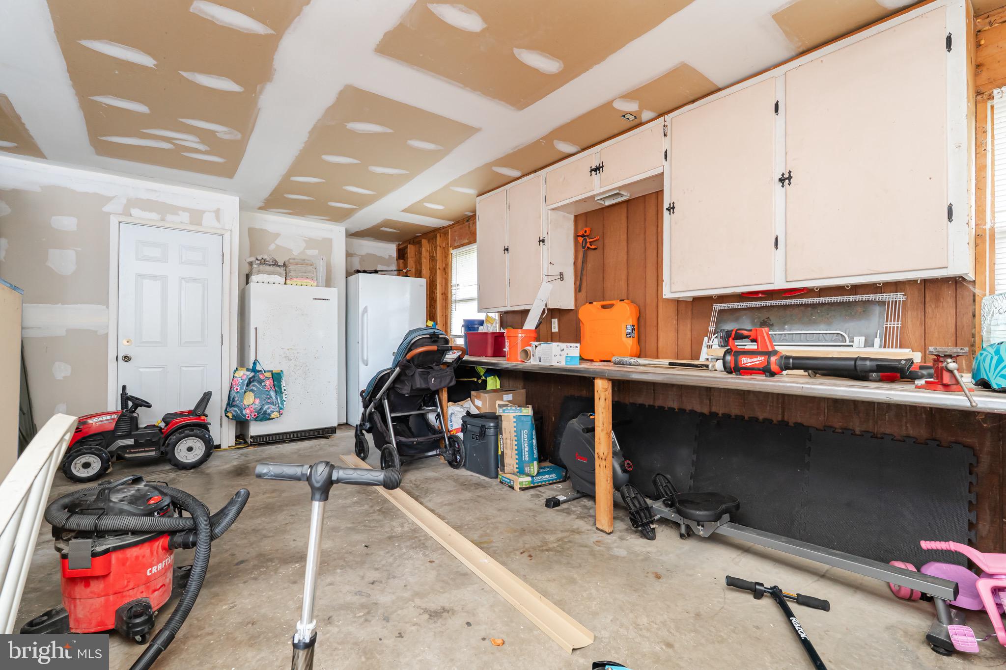 1414 Kitchens Orchard Falling Waters, WV 25419 - Photo 53 of 55 a room with gym equipment and a mirror