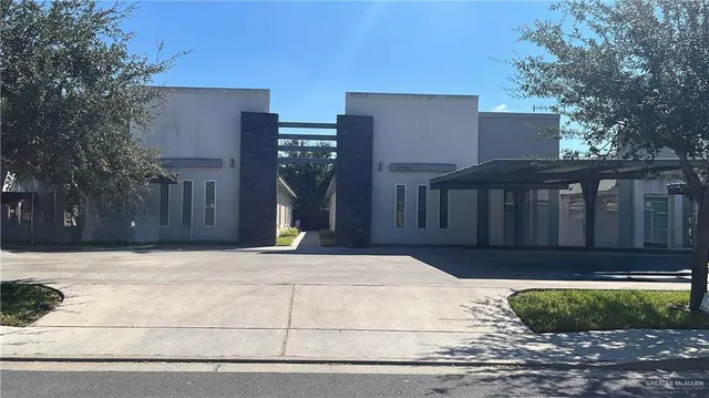 a view of a house with a backyard