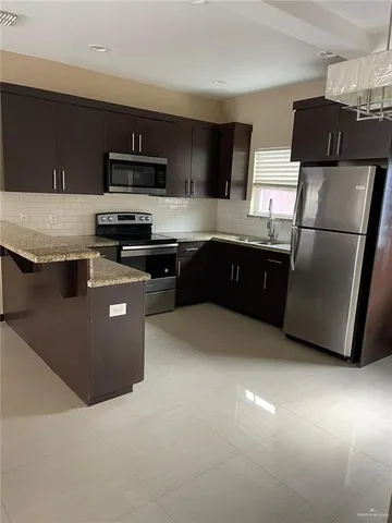 a view of small space with closet and mirror