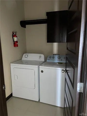 a view of a kitchen from the hallway