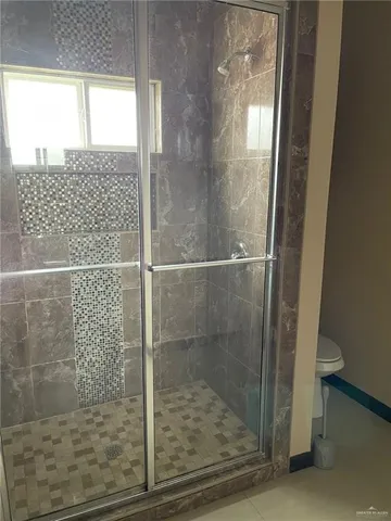 a bathroom with a bathtub and a shower
