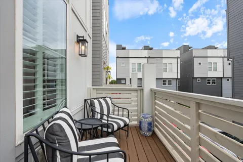 a view of a balcony with chairs