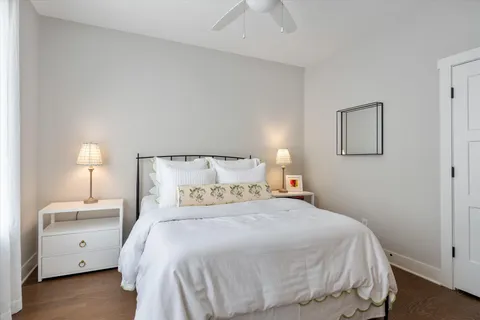 a bedroom with a bed and a lamp