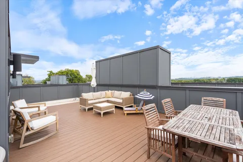 a terrace of a house with outdoor seating