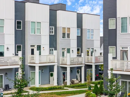 a view of a patio with couches and a table and chairs
