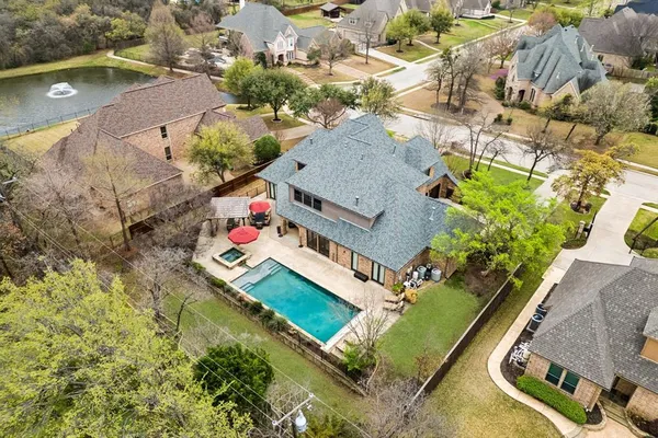 an aerial view of house with yard