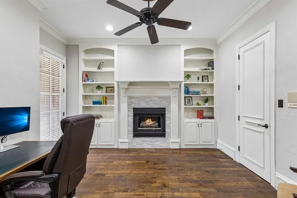 a living room with furniture ceiling fan and a rug