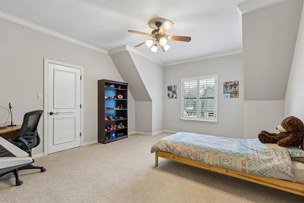 a bedroom with a bed and a view of bathroom