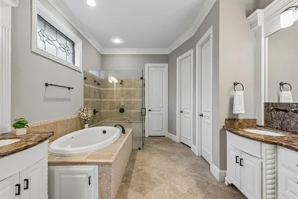 a view of cabinets and utility room with wooden floor
