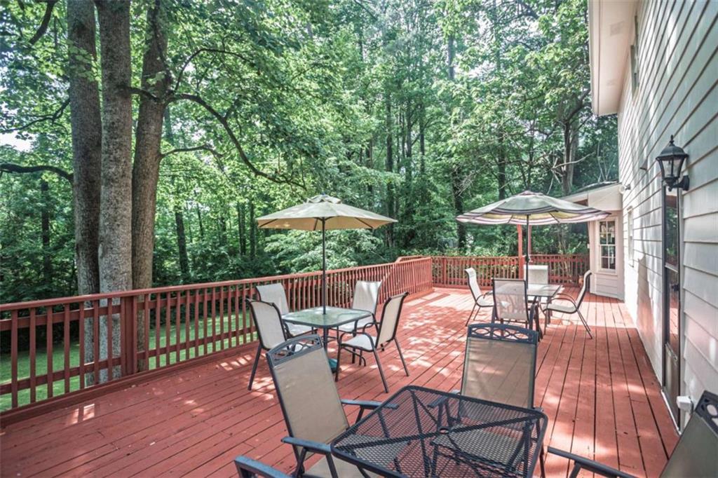 3838 Hunting Ridge Drive Southwest Lilburn, GA 30047 - Photo 49 of 56 an outdoor space with furniture and umbrella
