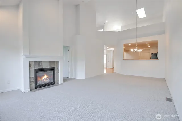 a view of an empty room with a fireplace
