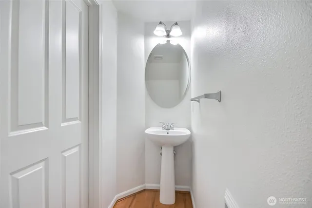 a view of a mirror with sink and mirror