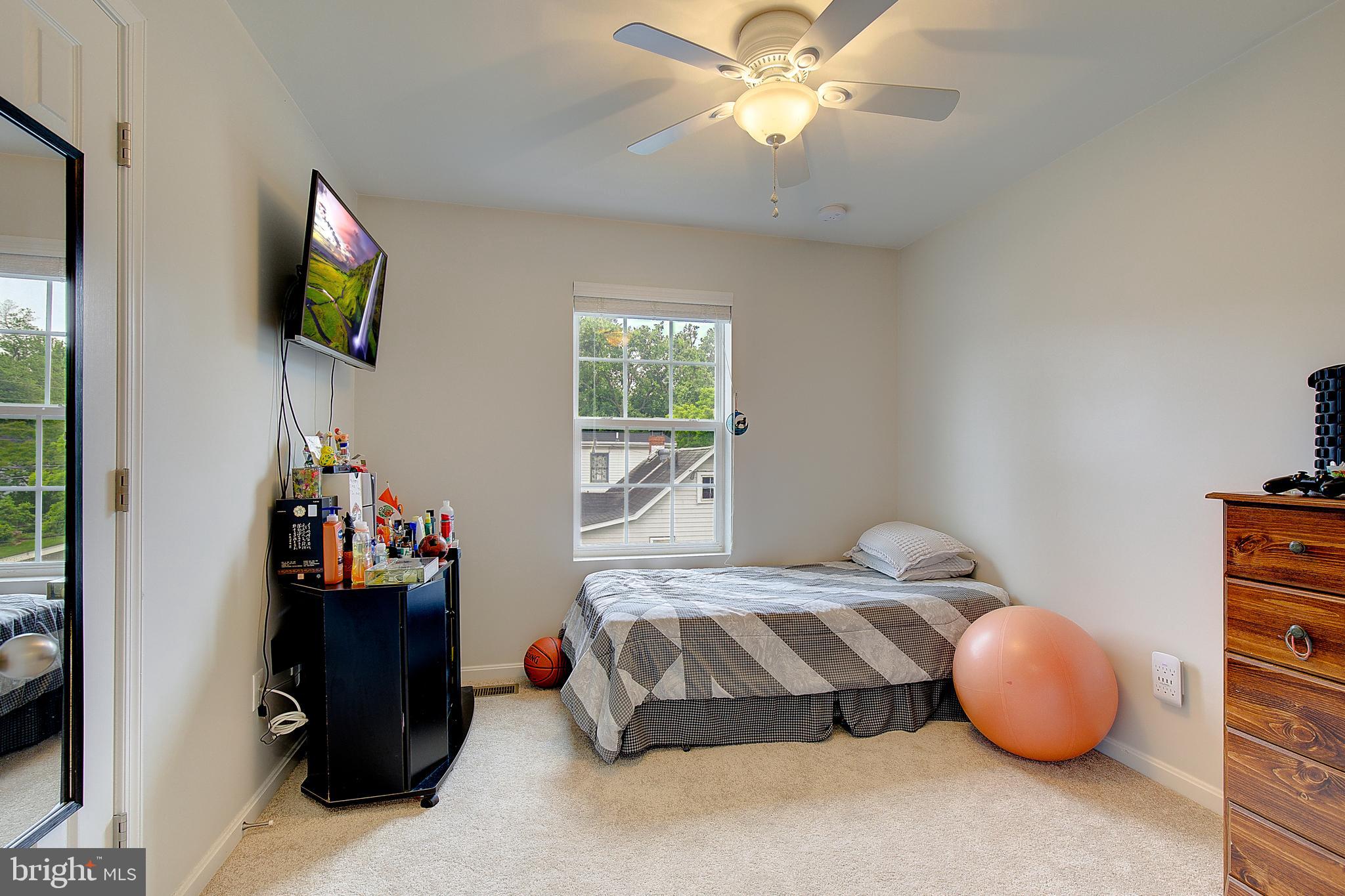 403 Venton Road Edgewater, MD 21037 - Photo 25 of 62 a bedroom with a bed and flat screen tv