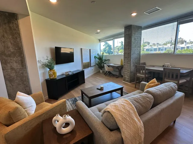 a living room with furniture and a flat screen tv
