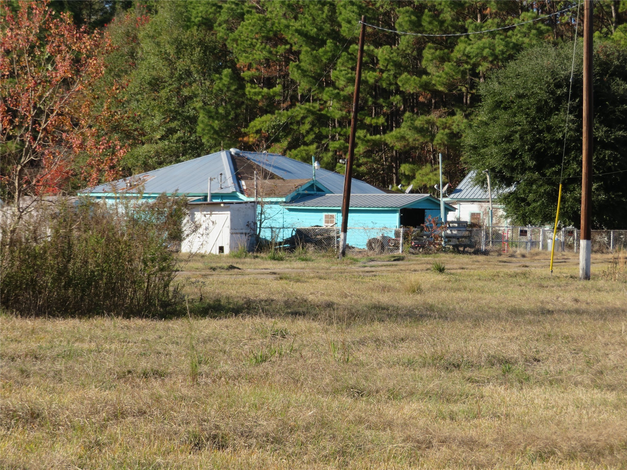 27169 Highway 146 Cleveland, TX 77327 - Photo 5 of 10 a house view with a outdoor space