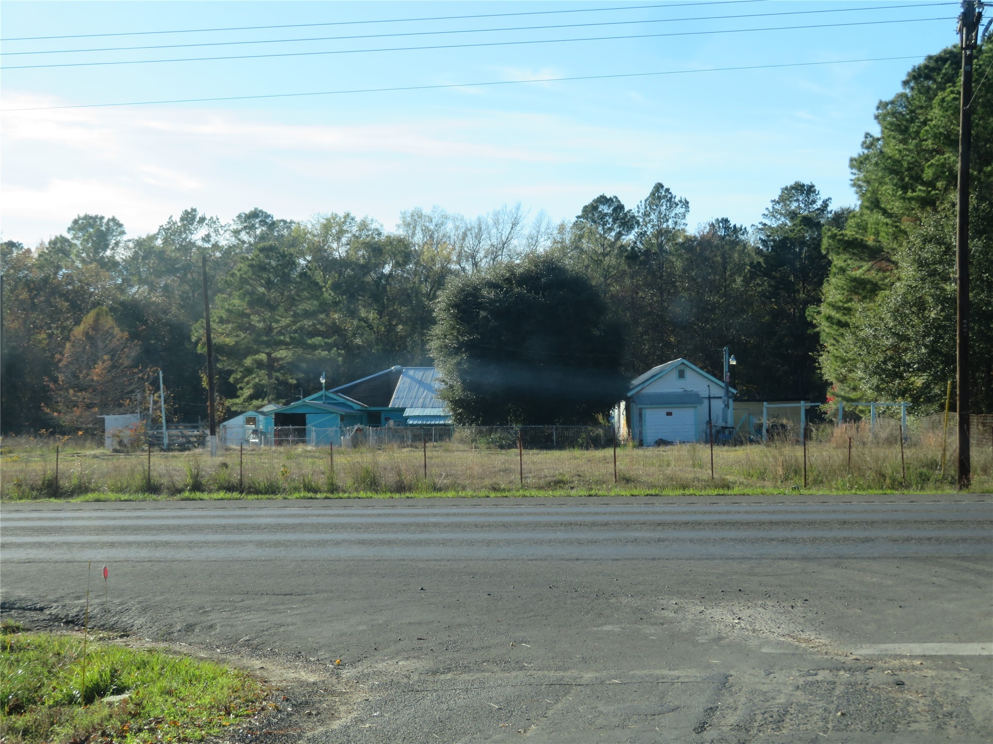 27169 Highway 146 Cleveland, TX 77327 - Photo 6 of 10 a view of a town with mountains & house in the background