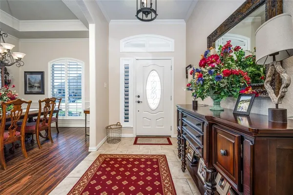 a living room with furniture and flowers