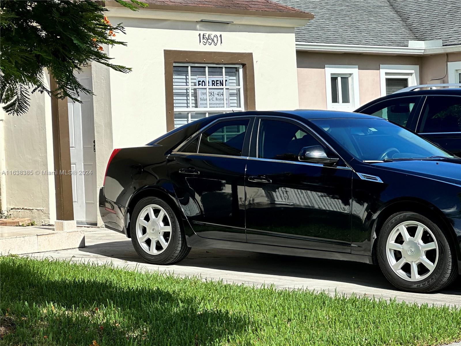 15501 Southwest 143rd Avenue, Unit 15501 Miami, FL 33177 - Photo 2 of 11 a car parked in front of a house