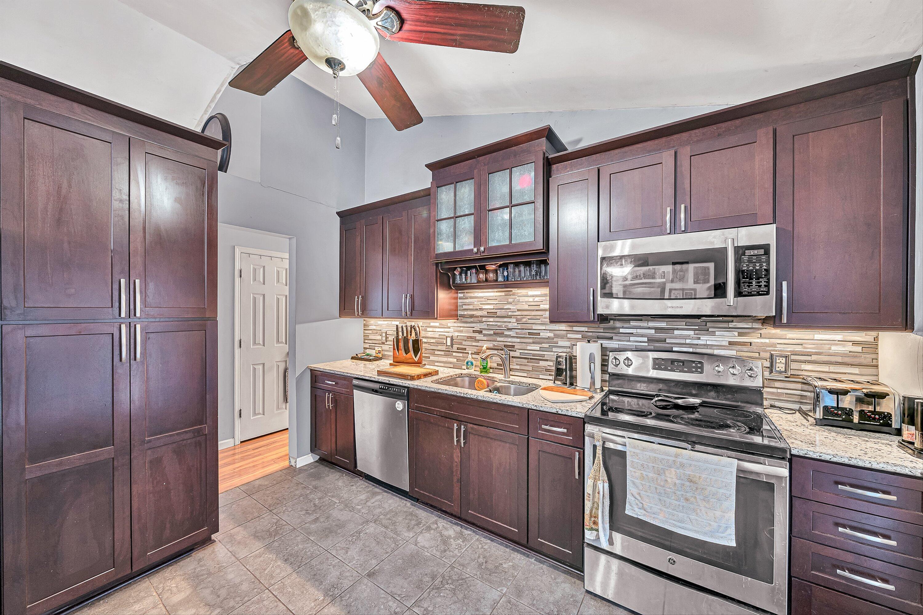 769 Lakeshore Terrace Road Hardy, VA 24101 - Photo 11 of 38 a kitchen with stainless steel appliances granite countertop a stove and a refrigerator