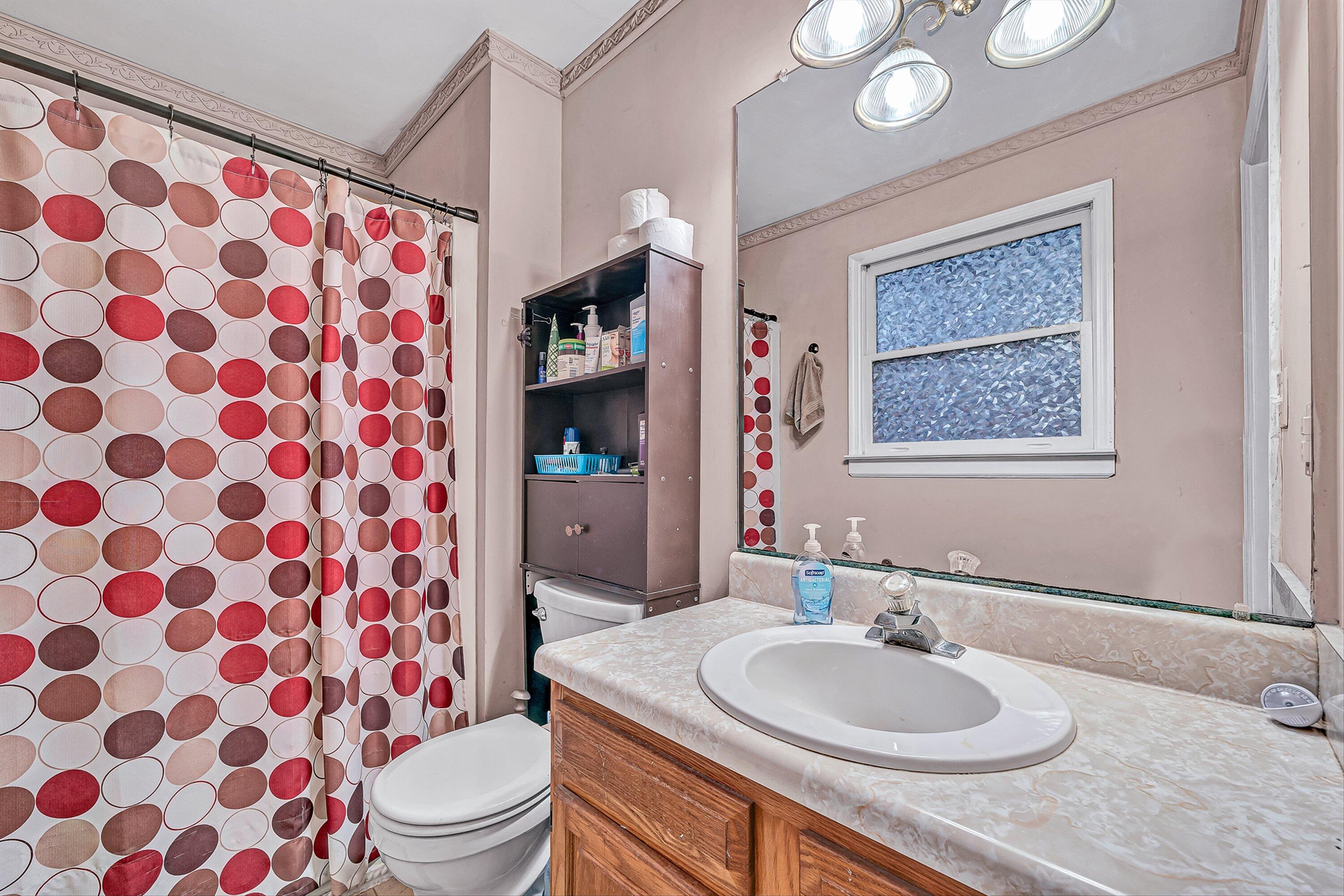 769 Lakeshore Terrace Road Hardy, VA 24101 - Photo 16 of 38 a bathroom with a sink toilet mirror and shower