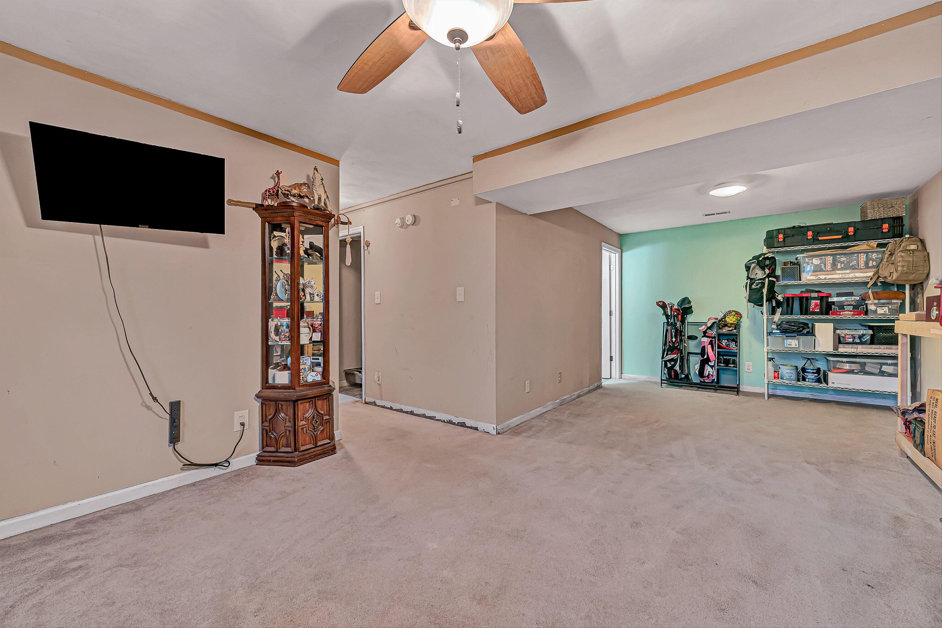 769 Lakeshore Terrace Road Hardy, VA 24101 - Photo 23 of 38 a view of a livingroom with furniture and a ceiling fan