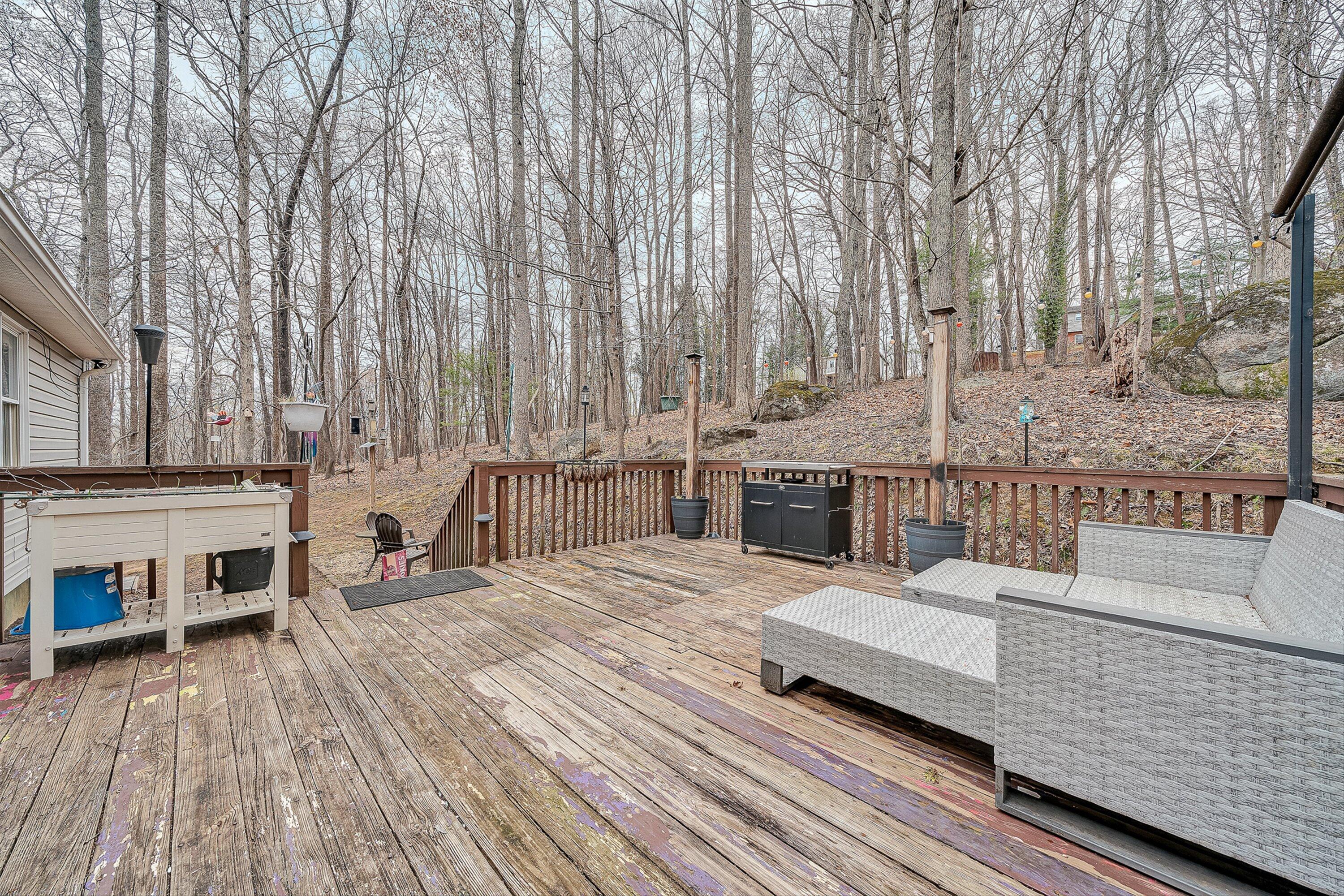 769 Lakeshore Terrace Road Hardy, VA 24101 - Photo 28 of 38 a view of roof deck with couches and chairs with wooden floor