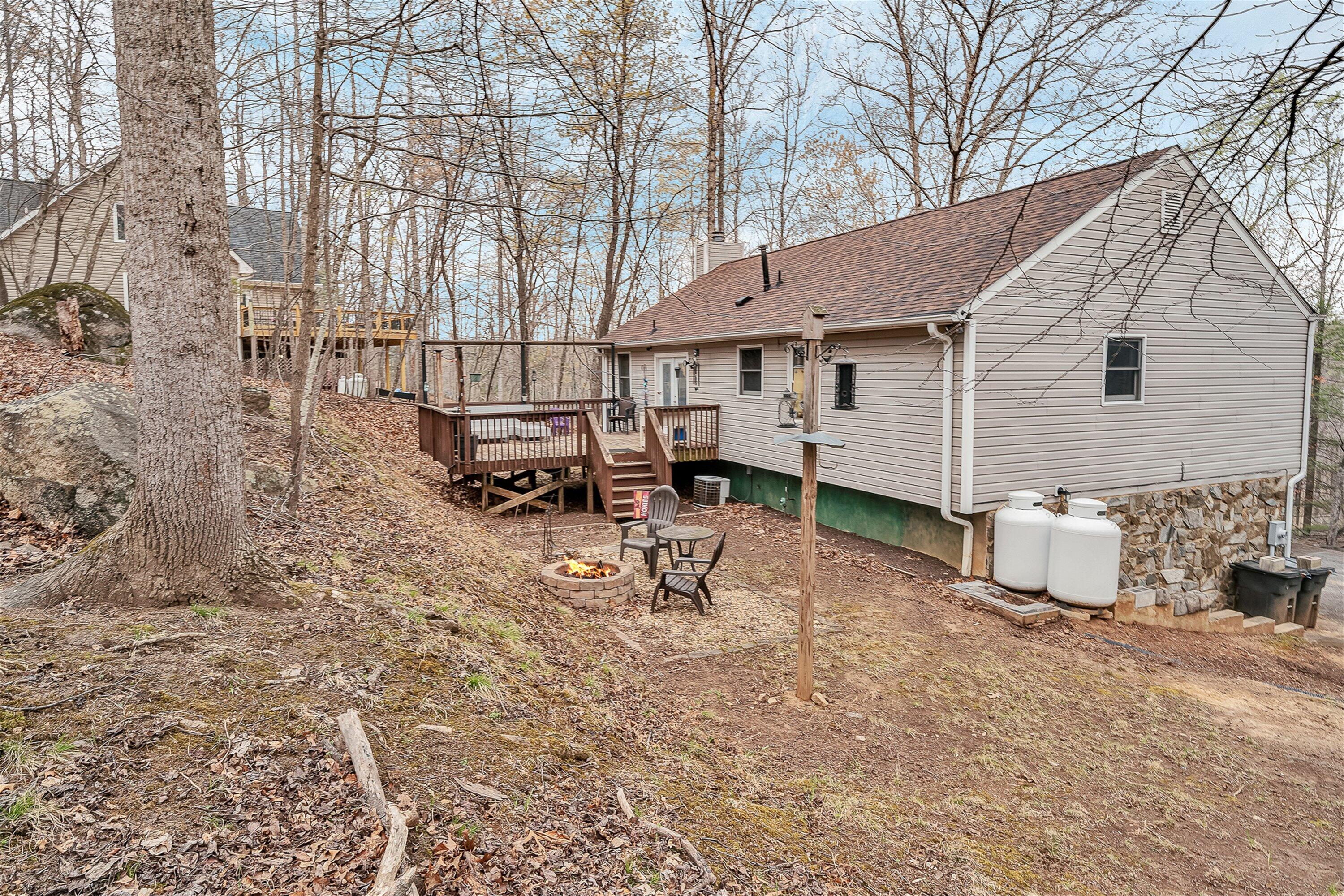 769 Lakeshore Terrace Road Hardy, VA 24101 - Photo 30 of 38 a view of a house with backyard and sitting area