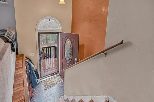 a view of entryway with wooden floor