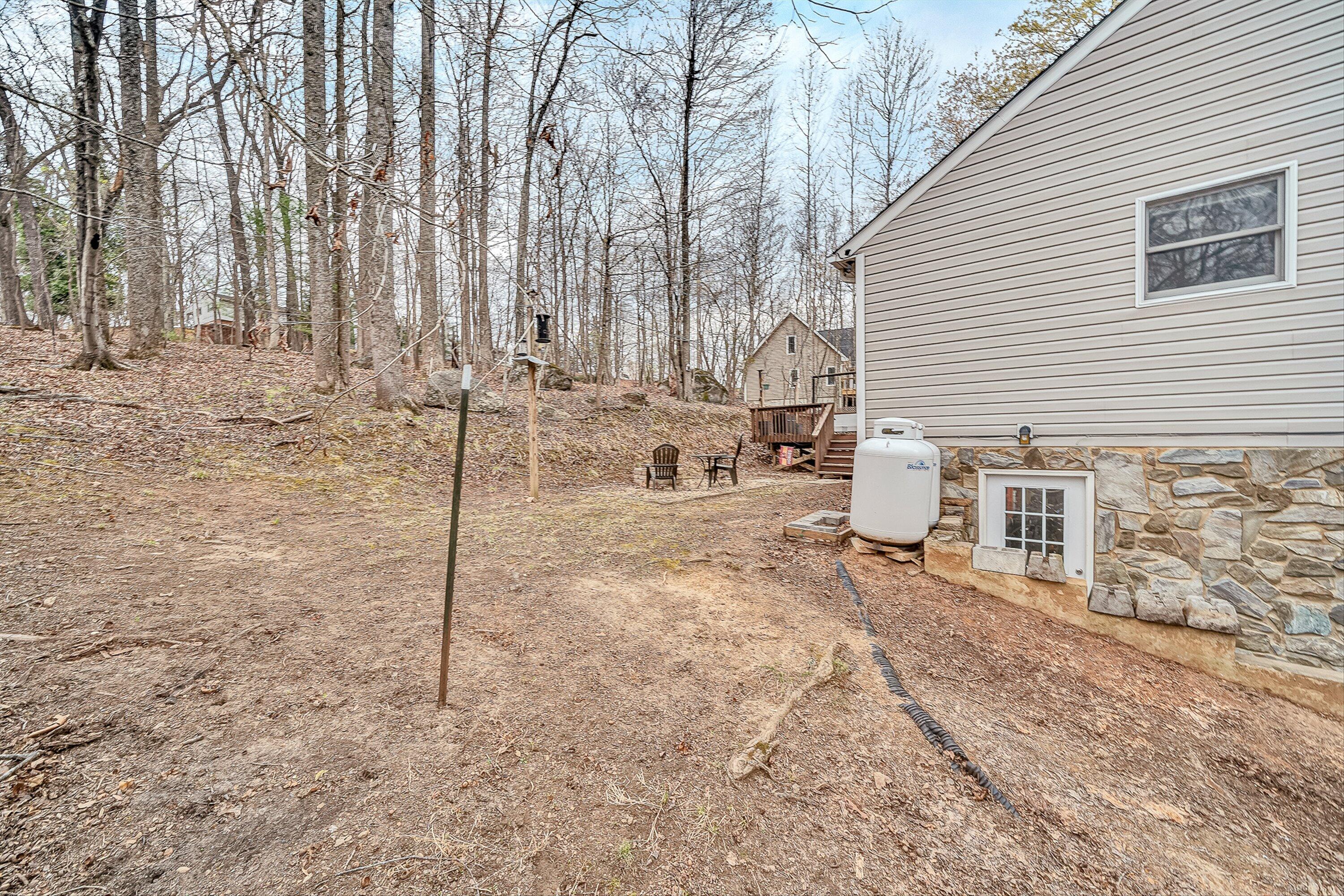 769 Lakeshore Terrace Road Hardy, VA 24101 - Photo 33 of 38 a view of a backyard with chairs