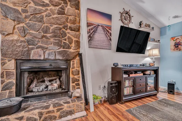 a living room with furniture and a fireplace