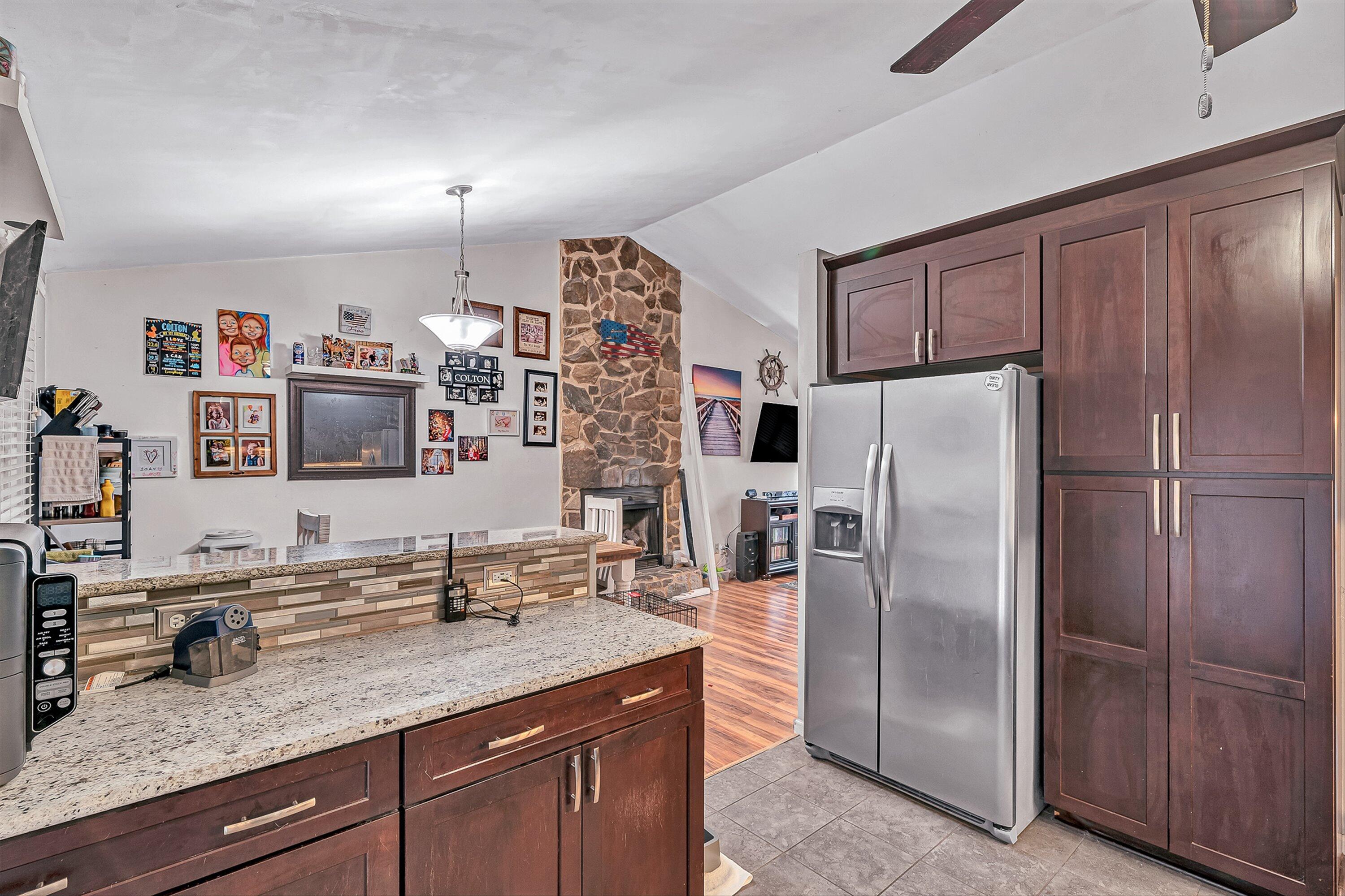 769 Lakeshore Terrace Road Hardy, VA 24101 - Photo 10 of 38 a kitchen with stainless steel appliances granite countertop a refrigerator and a sink