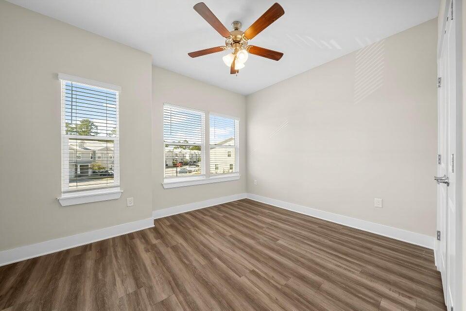 274 Date Palm Lane, Unit HORIZON Freeport, FL 32439 - Photo 15 of 25 wooden floor in an empty room with a window