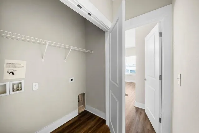 a view of a room with wooden floor