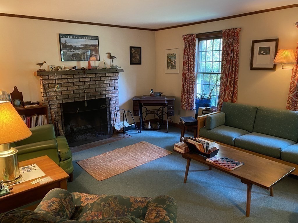 3 Beach Road Mattapoisett, MA 02739 - Photo 12 of 25 a living room with furniture and a fireplace