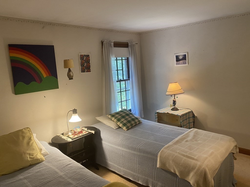 3 Beach Road Mattapoisett, MA 02739 - Photo 17 of 25 a bedroom with a bed and wooden floor