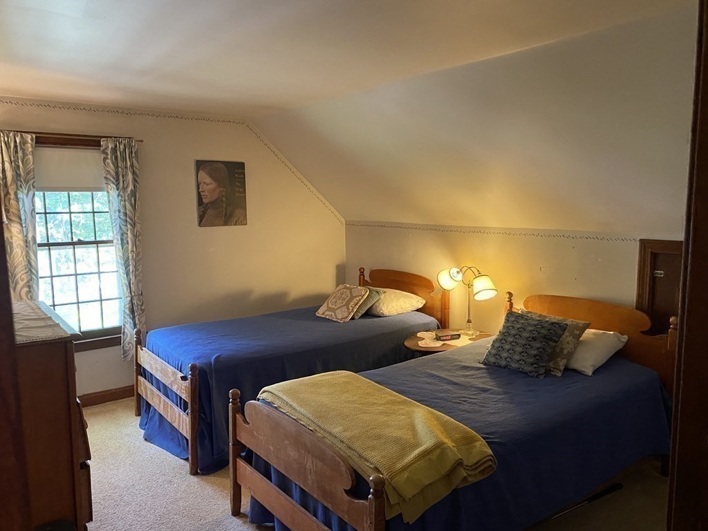 3 Beach Road Mattapoisett, MA 02739 - Photo 18 of 25 a bedroom with a bed and a window
